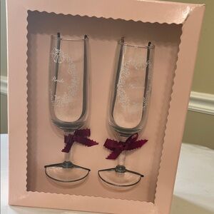 Elegant Glass Toasting Flutes with Burgundy Accents